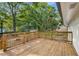 Spacious back deck with wooden railing, perfect for entertaining guests and enjoying the outdoor scenery at 6932 Eunice Dr, Riverdale, GA 30274