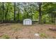 View of the large backyard and storage shed at 6932 Eunice Dr, Riverdale, GA 30274