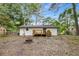 Exterior view of a home's back yard featuring a deck, a backyard, and a fire pit at 6932 Eunice Dr, Riverdale, GA 30274