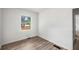 Bedroom featuring hardwood floors and a window with natural light at 6932 Eunice Dr, Riverdale, GA 30274