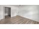 Bedroom with hardwood floors and closet with multiple doors at 6932 Eunice Dr, Riverdale, GA 30274