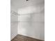 Walk in closet with shelves and hardwood floors at 6932 Eunice Dr, Riverdale, GA 30274