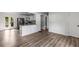 Open floor plan showcasing the kitchen with stainless appliances and breakfast bar overlooking the dining area at 6932 Eunice Dr, Riverdale, GA 30274