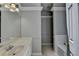 The bathroom has gray walls, white trim, a vanity, and an open entrance to the toilet at 2121 Crescentview Dr, Lawrenceville, GA 30044
