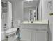 A fully equipped bathroom includes a toilet, sink, mirror, and shower at 2121 Crescentview Dr, Lawrenceville, GA 30044
