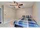 Bedroom with neutral colored walls, ceiling fan and window at 2121 Crescentview Dr, Lawrenceville, GA 30044