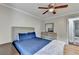 The bedroom has nice floors, a bed, a ceiling fan, and an attached bath at 2121 Crescentview Dr, Lawrenceville, GA 30044