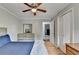Charming bedroom with hardwood floors, large closet and dresser with a large mirror at 2121 Crescentview Dr, Lawrenceville, GA 30044