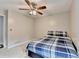 Neutral bedroom featuring ceiling fan, and a window providing natural light at 2121 Crescentview Dr, Lawrenceville, GA 30044
