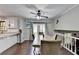 Bright dining area with a ceiling fan, wooden table and chairs with french doors leading to the outside at 2121 Crescentview Dr, Lawrenceville, GA 30044