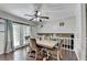 Bright dining area with a ceiling fan, wooden table and chairs and view to second floor at 2121 Crescentview Dr, Lawrenceville, GA 30044