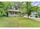 Charming two-story home featuring a covered porch and a traditional brick and siding exterior at 2121 Crescentview Dr, Lawrenceville, GA 30044