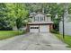 Charming two-story home featuring a two-car garage and a traditional brick and siding exterior at 2121 Crescentview Dr, Lawrenceville, GA 30044