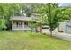 Charming two-story home featuring a covered porch and a traditional brick and siding exterior at 2121 Crescentview Dr, Lawrenceville, GA 30044