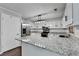 Updated kitchen boasts granite countertops, stainless steel appliances, and ample cabinetry at 2121 Crescentview Dr, Lawrenceville, GA 30044