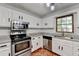 Well-equipped kitchen featuring granite countertops, stainless steel appliances and lots of cabinets at 2121 Crescentview Dr, Lawrenceville, GA 30044