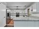 Updated kitchen boasts granite countertops, stainless steel appliances, and ample cabinetry at 2121 Crescentview Dr, Lawrenceville, GA 30044