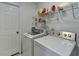 Functional laundry area featuring modern appliances and convenient shelf storage at 2121 Crescentview Dr, Lawrenceville, GA 30044