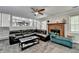 Living room features fireplace, view to dining area, and L-shaped leather sofa at 2121 Crescentview Dr, Lawrenceville, GA 30044