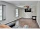 Spacious living room featuring hardwood floors, crown molding, a ceiling fan, and large windows at 2121 Crescentview Dr, Lawrenceville, GA 30044