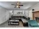 Spacious living room with fireplace and an L-shaped leather couch at 2121 Crescentview Dr, Lawrenceville, GA 30044