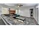 Living room features hardwood fireplace, dark leather seating and a ceiling fan at 2121 Crescentview Dr, Lawrenceville, GA 30044