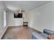 Spacious living room featuring hardwood floors, crown molding, a ceiling fan, and large windows at 2121 Crescentview Dr, Lawrenceville, GA 30044