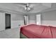 Bedroom with tray ceiling, adjoining bath, and closet access at 2121 Crescentview Dr, Lawrenceville, GA 30044