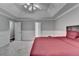 Main bedroom with tray ceiling, a ceiling fan and ensuite access at 2121 Crescentview Dr, Lawrenceville, GA 30044