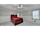 Spacious main bedroom with a tray ceiling and neutral carpet at 2121 Crescentview Dr, Lawrenceville, GA 30044