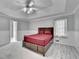 This bedroom features a tray ceiling and soft carpeting at 2121 Crescentview Dr, Lawrenceville, GA 30044
