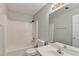 A white bathroom featuring a tub/shower combination and a vanity with a mirror at 2355 Glen Chase Ln, Lawrenceville, GA 30044