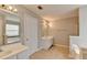 Modern bathroom with dual vanities, a separate shower and tub, and stylish tile flooring at 2355 Glen Chase Ln, Lawrenceville, GA 30044
