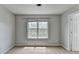 Bright carpeted bedroom with neutral walls, and an open doorway at 2355 Glen Chase Ln, Lawrenceville, GA 30044