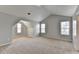 Bright carpeted bonus room with neutral walls and multiple windows at 2355 Glen Chase Ln, Lawrenceville, GA 30044