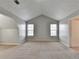 A carpeted bonus room featuring an attic storage nook and neutral walls at 2355 Glen Chase Ln, Lawrenceville, GA 30044