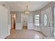 Dining area with tile floor, chandelier, and entry door at 2355 Glen Chase Ln, Lawrenceville, GA 30044