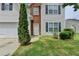 Detailed view of the home's exterior highlighting architectural details and front yard landscaping at 2355 Glen Chase Ln, Lawrenceville, GA 30044