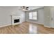 Spacious living room with fireplace, ample natural light, and modern flooring at 2355 Glen Chase Ln, Lawrenceville, GA 30044