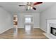 Bright living room with hardwood floors, fireplace, and dining room at 2355 Glen Chase Ln, Lawrenceville, GA 30044