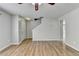 Spacious living room with hardwood floors, ceiling fan, and staircase to the second floor at 2355 Glen Chase Ln, Lawrenceville, GA 30044