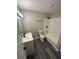 Renovated bathroom showcasing white vanity, modern fixtures, and subway tiles at 3730 Clovis Nw Ct, Atlanta, GA 30331
