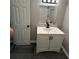 Updated bathroom with a modern vanity, white subway tile in the shower, and gray plank flooring at 3730 Clovis Nw Ct, Atlanta, GA 30331
