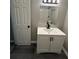 Updated bathroom with a modern vanity, white subway tile in the shower, and gray plank flooring at 3730 Clovis Nw Ct, Atlanta, GA 30331