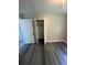 Bedroom with a closet, gray plank flooring and base molding at 3730 Clovis Nw Ct, Atlanta, GA 30331