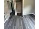 View from bedroom to hallway featuring gray walls, gray wood-look flooring, and closet at 3730 Clovis Nw Ct, Atlanta, GA 30331