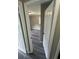 View through the doorway of a bedroom featuring gray walls, gray wood-look flooring, and a window at 3730 Clovis Nw Ct, Atlanta, GA 30331
