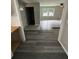 Inviting foyer showcasing new gray vinyl flooring and ample natural light at 3730 Clovis Nw Ct, Atlanta, GA 30331