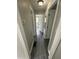 Hallway featuring gray wood-look flooring and multiple doorways at 3730 Clovis Nw Ct, Atlanta, GA 30331