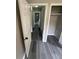 Hallway with gray wood-look floors and white trim at 3730 Clovis Nw Ct, Atlanta, GA 30331